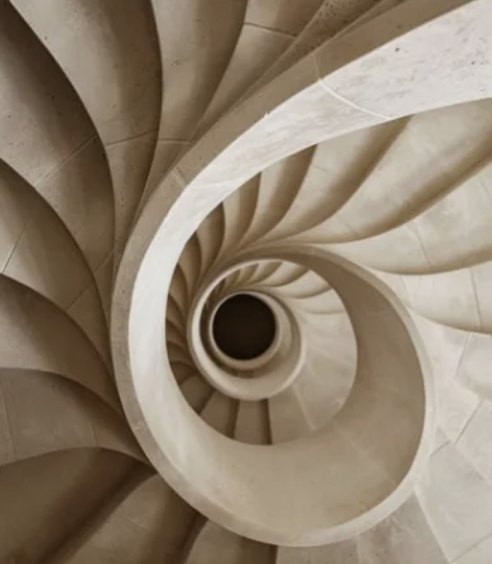 Sculptural stone spiral staircase